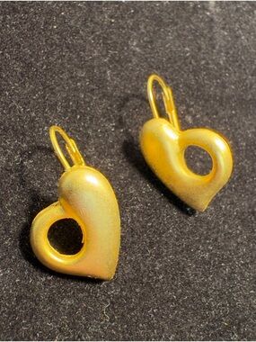 Vintage-style cutout heart earrings matte gold-tone finish-lever-back closure.